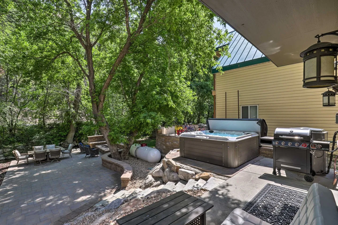 The cabin's backyard grill and fire pit